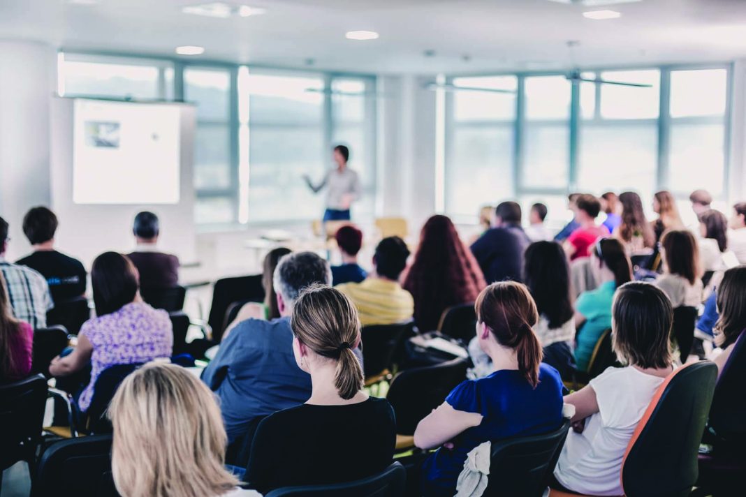 Business,And,Entrepreneurship,Symposium.,Speaker,Giving,A,Talk,At,Business