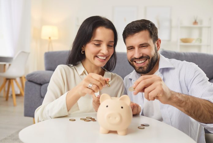 Family,Couple,Saving,Up,Some,Money,For,A,Mortgage,Or PEL Tribune