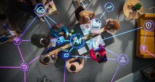 Diverse,Team,Collaborating,With,Ai,Tools,In,A,Modern,Office L'IA et les entreprises
