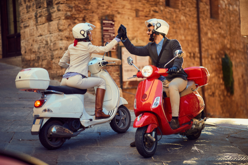 Young,Italian,Couple,On,Vespa,Scooter.,Bikers,Couple. Vespa